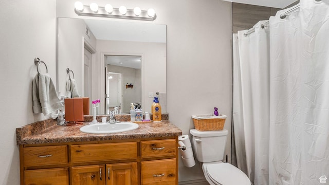 bathroom with visible vents, toilet, vanity, and a shower with curtain