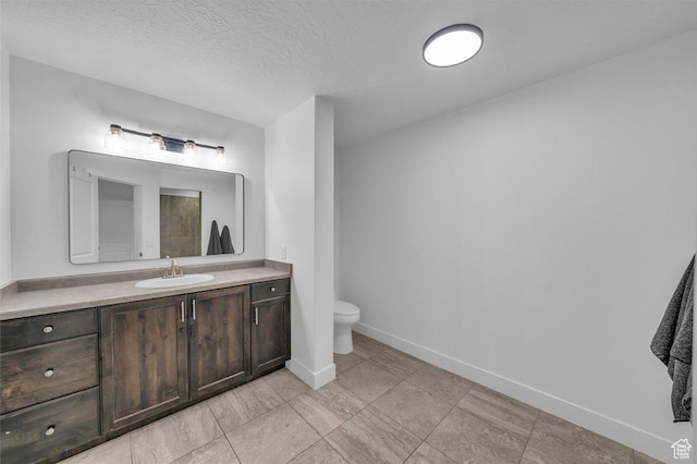 3231 S 300 W, Washington, UT 84780 - bathroom with vanity, baseboards, a textured ceiling, and toilet