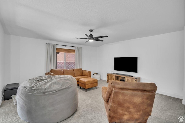 3231 S 300 W, Washington, UT 84780 - living area with baseboards, light colored carpet, a textured ceiling, and ceiling fan