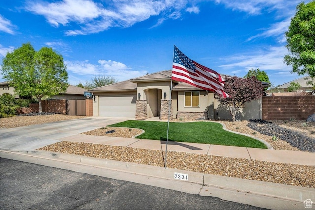 3231 S 300 W, Washington, UT 84780 - view of front of property featuring stucco siding, driveway, stone siding, a garage, and fence
