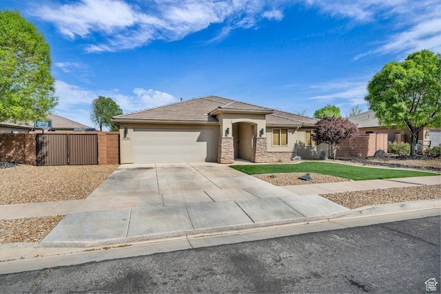 3231 S 300 W, Washington, UT 84780 - view of front facade featuring driveway, fence, a garage, and stucco siding
