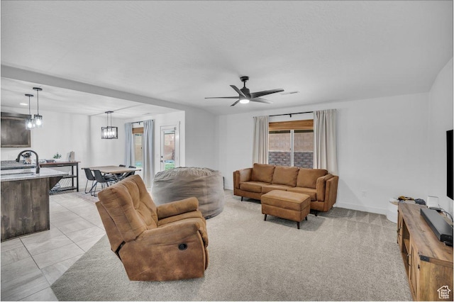 3231 S 300 W, Washington, UT 84780 - living room featuring baseboards, light tile patterned flooring, and ceiling fan with notable chandelier