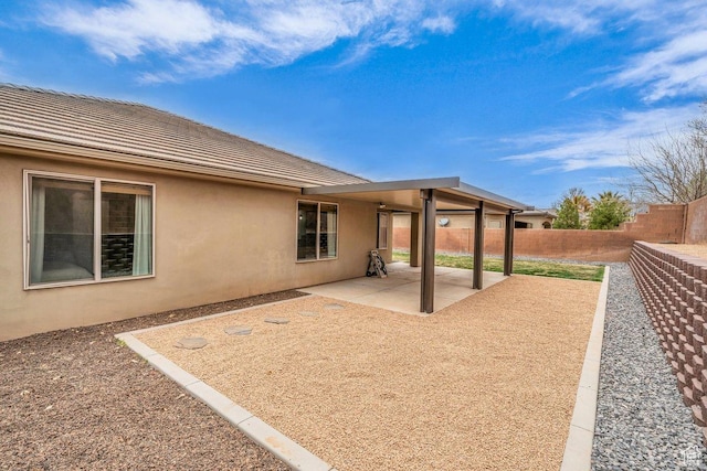 3231 S 300 W, Washington, UT 84780 - rear view of property with a patio, stucco siding, fence, and a tile roof