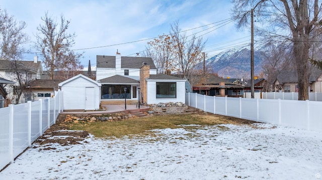 130 E 200 S, Provo, UT 84606 - snow covered back of property featuring an outbuilding, a shed, and a fenced backyard