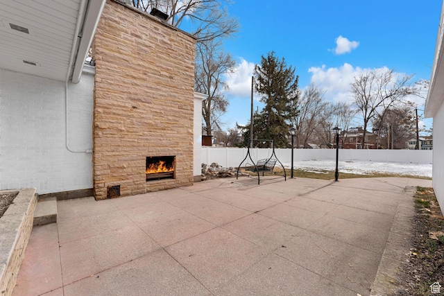 130 E 200 S, Provo, UT 84606 - view of patio featuring a fenced backyard and an outdoor stone fireplace