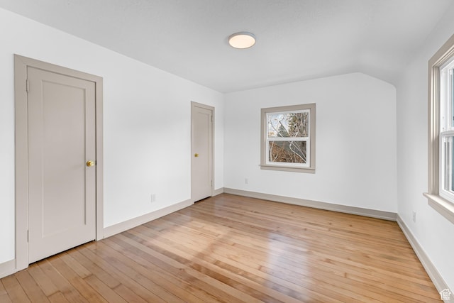 130 E 200 S, Provo, UT 84606 - spare room featuring light wood-type flooring, baseboards, and vaulted ceiling