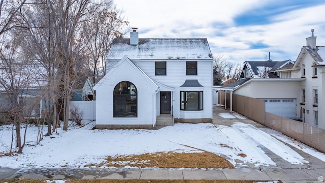 130 E 200 S, Provo, UT 84606 - view of front of house featuring an attached garage, a chimney, and fence