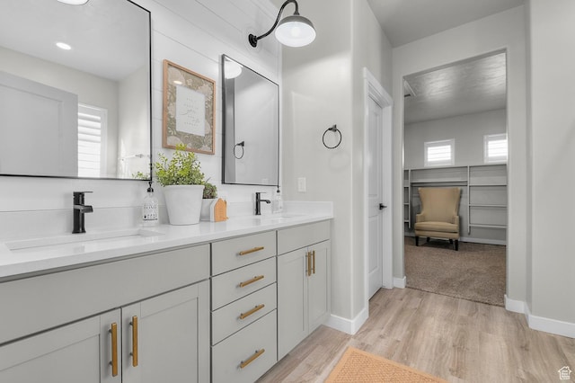 134 E Marciano Way, Grantsville, UT 84029 - full bathroom with double vanity, wood finished floors, baseboards, and a sink