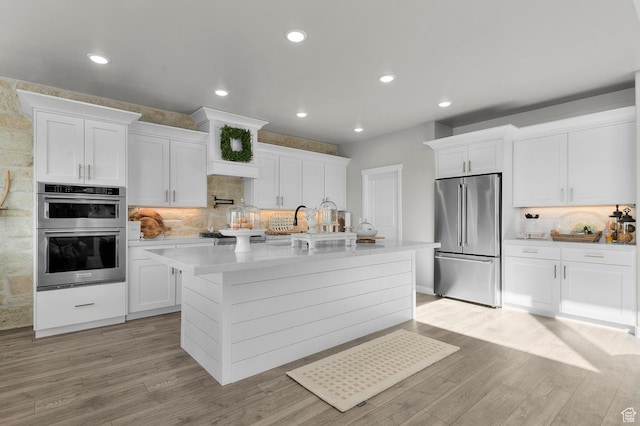 134 E Marciano Way, Grantsville, UT 84029 - kitchen featuring light countertops, white cabinetry, stainless steel appliances, and tasteful backsplash