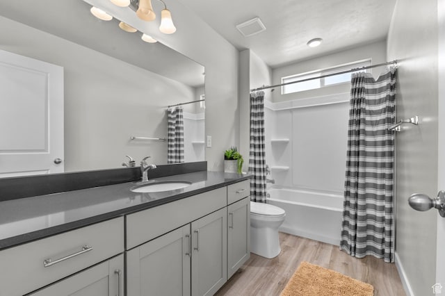 134 E Marciano Way, Grantsville, UT 84029 - bathroom featuring shower / bath combination with curtain, toilet, wood finished floors, and vanity