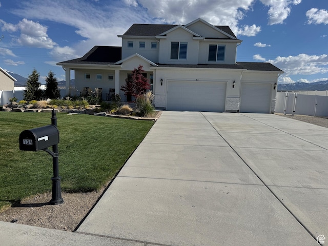 134 E Marciano Way, Grantsville, UT 84029 - view of front of property featuring a garage, stucco siding, fence, concrete driveway, and a front yard