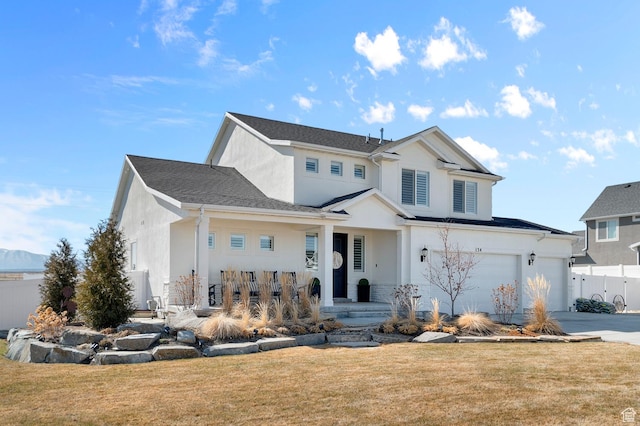134 E Marciano Way, Grantsville, UT 84029 - view of front of home featuring a front yard, stucco siding, covered porch, and fence