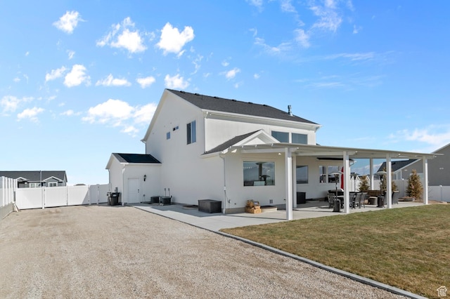 134 E Marciano Way, Grantsville, UT 84029 - back of house with a patio, a gate, fence, and a lawn
