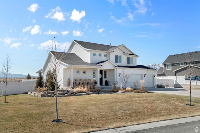 134 E Marciano Way, Grantsville, UT 84029 - traditional home with an attached garage, fence, concrete driveway, a front lawn, and a porch