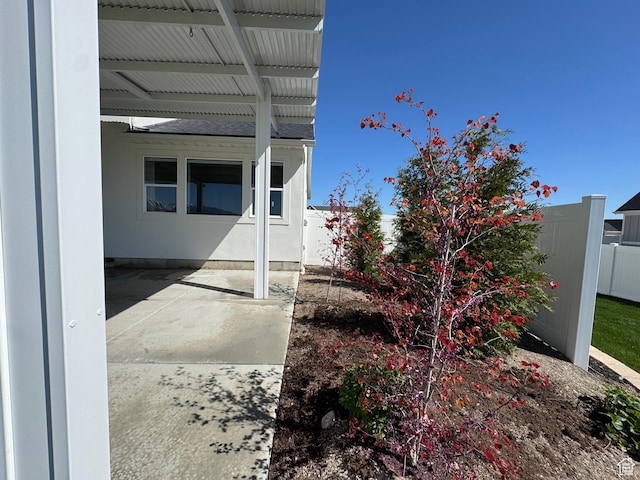 134 E Marciano Way, Grantsville, UT 84029 - view of property exterior with a patio area, roof with shingles, and fence