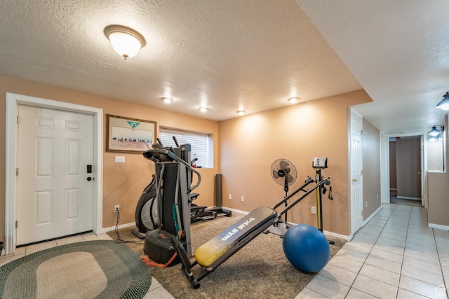 2602 W 1800 S, West Haven, UT 84401 - workout room featuring a textured ceiling, baseboards, and light tile patterned flooring