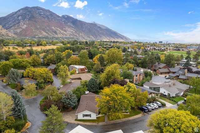 birds eye view of property with a mountain view and a residential view