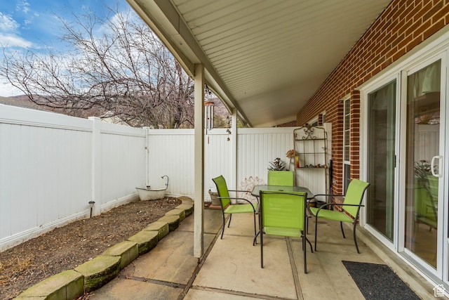 203 W Pheasantbrook Dr N, Centerville, UT 84014 - view of patio featuring outdoor dining space and a fenced backyard