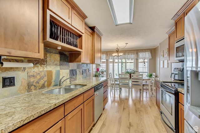 203 W Pheasantbrook Dr N, Centerville, UT 84014 - kitchen with brown cabinets, appliances with stainless steel finishes, and a sink