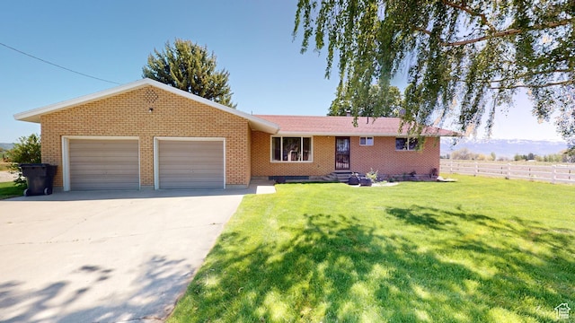 1207 S 600 W, Preston, ID 83263 - single story home featuring brick siding, a garage, and concrete driveway