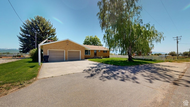 1207 S 600 W, Preston, ID 83263 - single story home featuring brick siding, driveway, and a garage