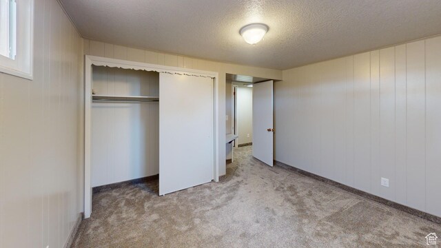1207 S 600 W, Preston, ID 83263 - unfurnished bedroom with a textured ceiling, carpet, and a closet
