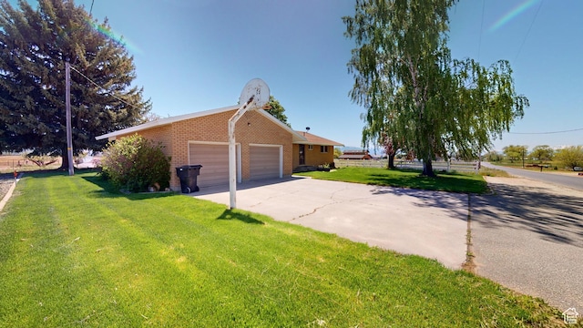 1207 S 600 W, Preston, ID 83263 - view of side of property with brick siding, a yard, and driveway