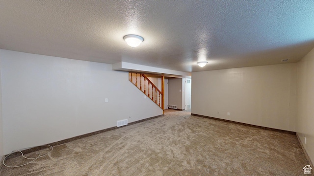 1207 S 600 W, Preston, ID 83263 - finished below grade area with a textured ceiling, carpet floors, and stairway