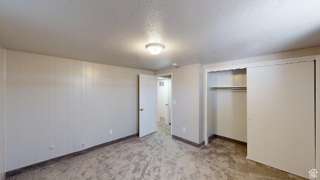 1207 S 600 W, Preston, ID 83263 - unfurnished bedroom with carpet flooring, a closet, and a textured ceiling