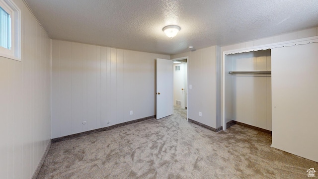 1207 S 600 W, Preston, ID 83263 - unfurnished bedroom featuring a textured ceiling, carpet, and a closet