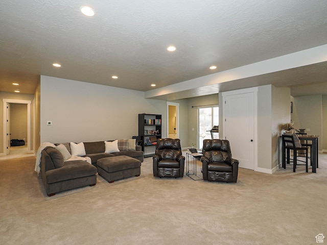 living room with recessed lighting, carpet, and a textured ceiling