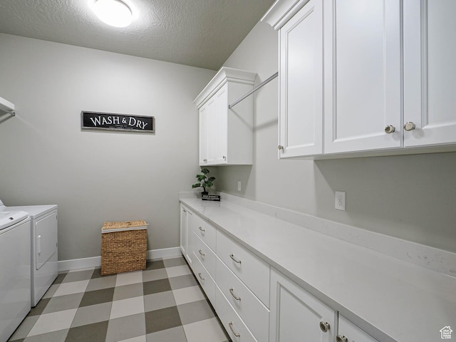 laundry room featuring independent washer and dryer, a textured ceiling, cabinet space, baseboards, and light floors