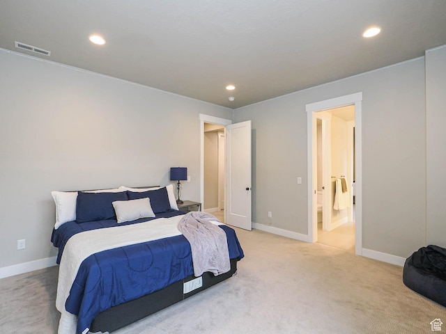 bedroom with recessed lighting, visible vents, light carpet, and baseboards