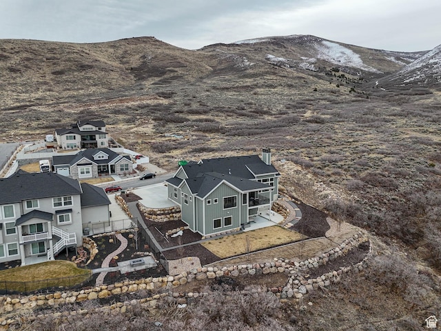 drone / aerial view featuring a mountain view and a residential view