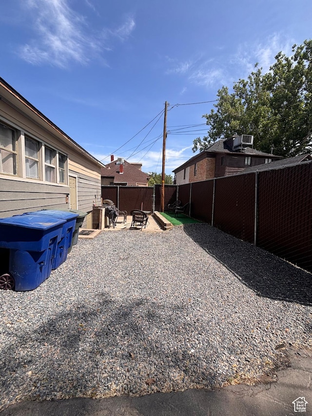 2516 S Orchard Ave, Ogden, UT 84401 - fenced backyard featuring an outdoor fire pit and a patio area
