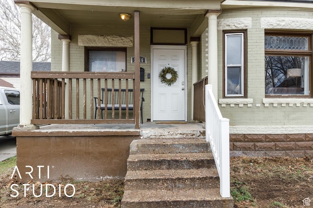 2516 S Orchard Ave, Ogden, UT 84401 - view of exterior entry with brick siding and covered porch