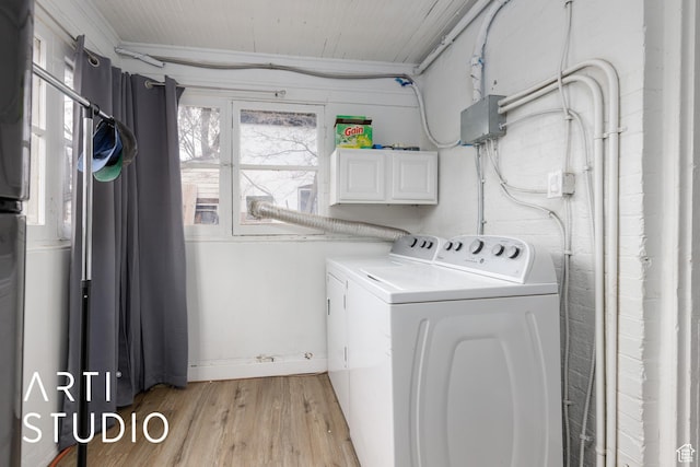 2516 S Orchard Ave, Ogden, UT 84401 - laundry room with cabinet space, independent washer and dryer, and light wood finished floors