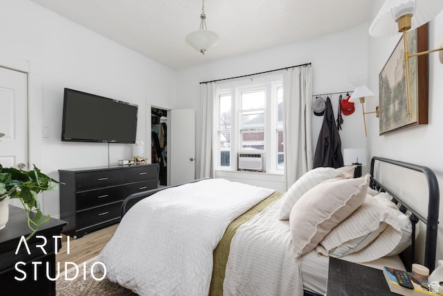 2516 S Orchard Ave, Ogden, UT 84401 - bedroom featuring light wood-type flooring and cooling unit