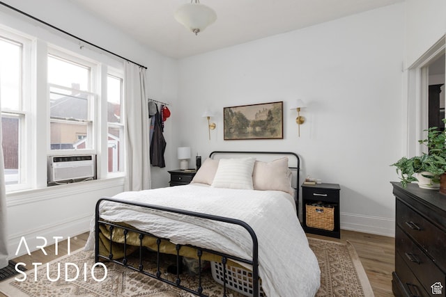 2516 S Orchard Ave, Ogden, UT 84401 - bedroom with cooling unit, wood finished floors, and baseboards