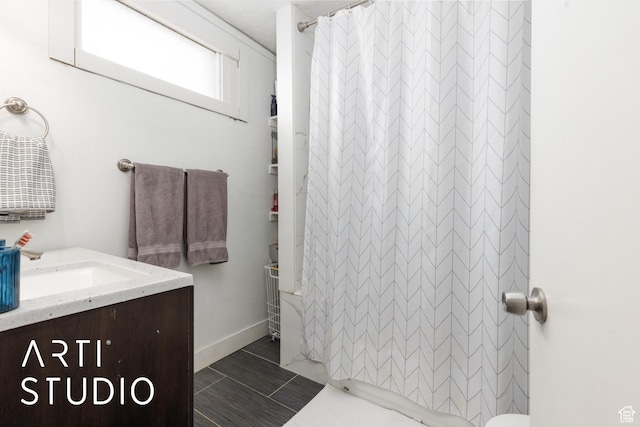 2516 S Orchard Ave, Ogden, UT 84401 - bathroom featuring vanity, a shower with shower curtain, and baseboards