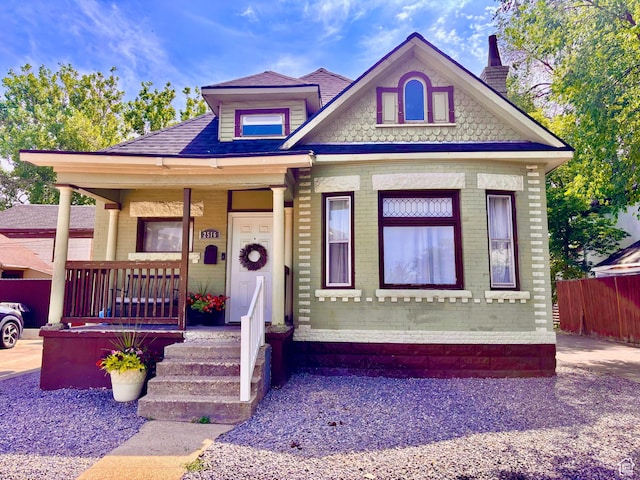 2516 S Orchard Ave, Ogden, UT 84401 - victorian home featuring a porch, a chimney, and brick siding