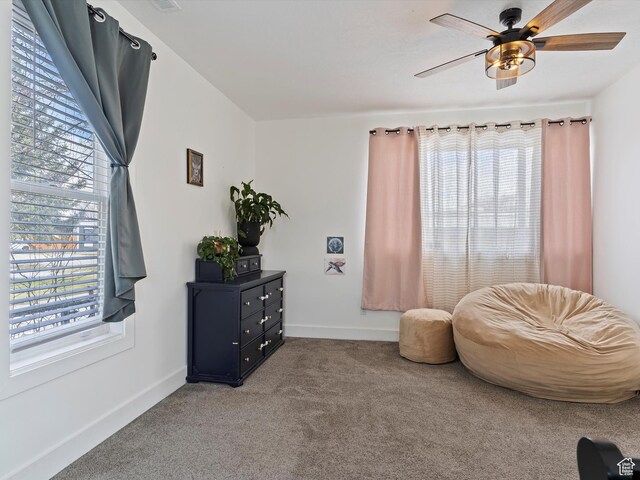 3911 W 2250 N, Corinne, UT 84307 - living area featuring carpet flooring, baseboards, and a ceiling fan