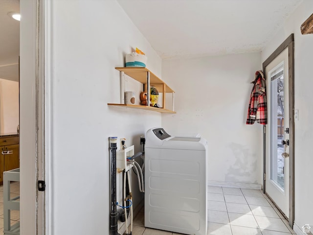 3911 W 2250 N, Corinne, UT 84307 - washroom featuring laundry area, light tile patterned flooring, baseboards, and washing machine and clothes dryer