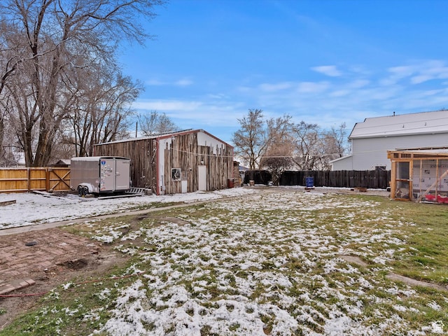 3911 W 2250 N, Corinne, UT 84307 - snowy yard with an outdoor structure and a fenced backyard
