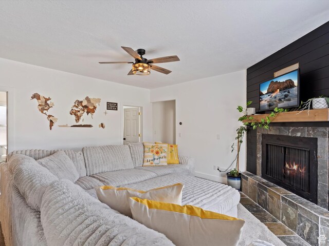 3911 W 2250 N, Corinne, UT 84307 - living area with a tiled fireplace, baseboards, and ceiling fan