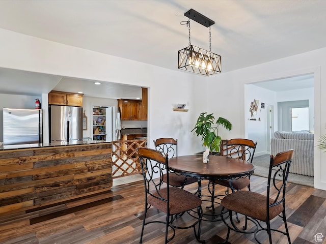 3911 W 2250 N, Corinne, UT 84307 - dining room featuring a notable chandelier and dark wood-style flooring