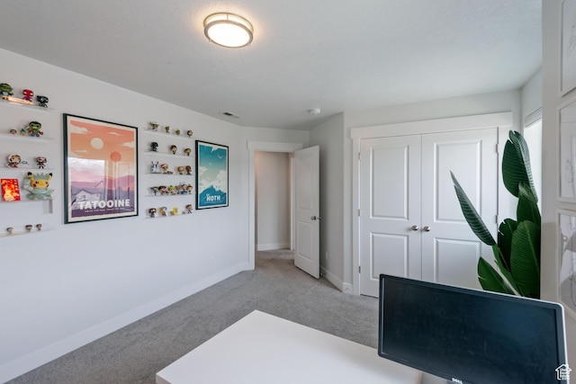 interior space featuring visible vents, baseboards, and light colored carpet