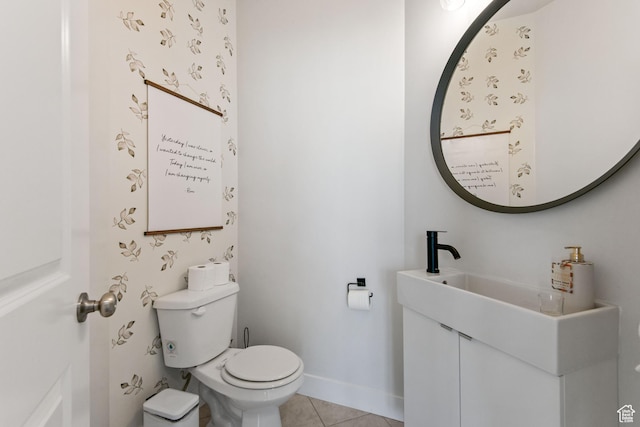 half bathroom featuring tile patterned floors, toilet, and baseboards