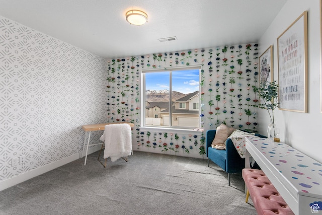bedroom featuring visible vents, baseboards, carpet flooring, and wallpapered walls