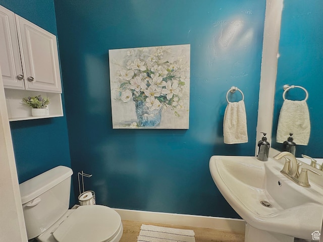 337 S 1540 E, Hyrum, UT 84319 - bathroom with baseboards, a sink, toilet, and wood finished floors